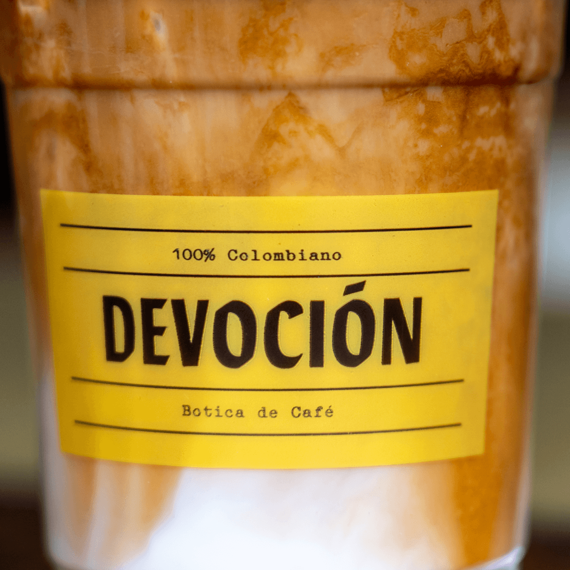 Closeup of a coffee cup from Devocion - Botica de Cafe in Williamsburg, Brooklyn.