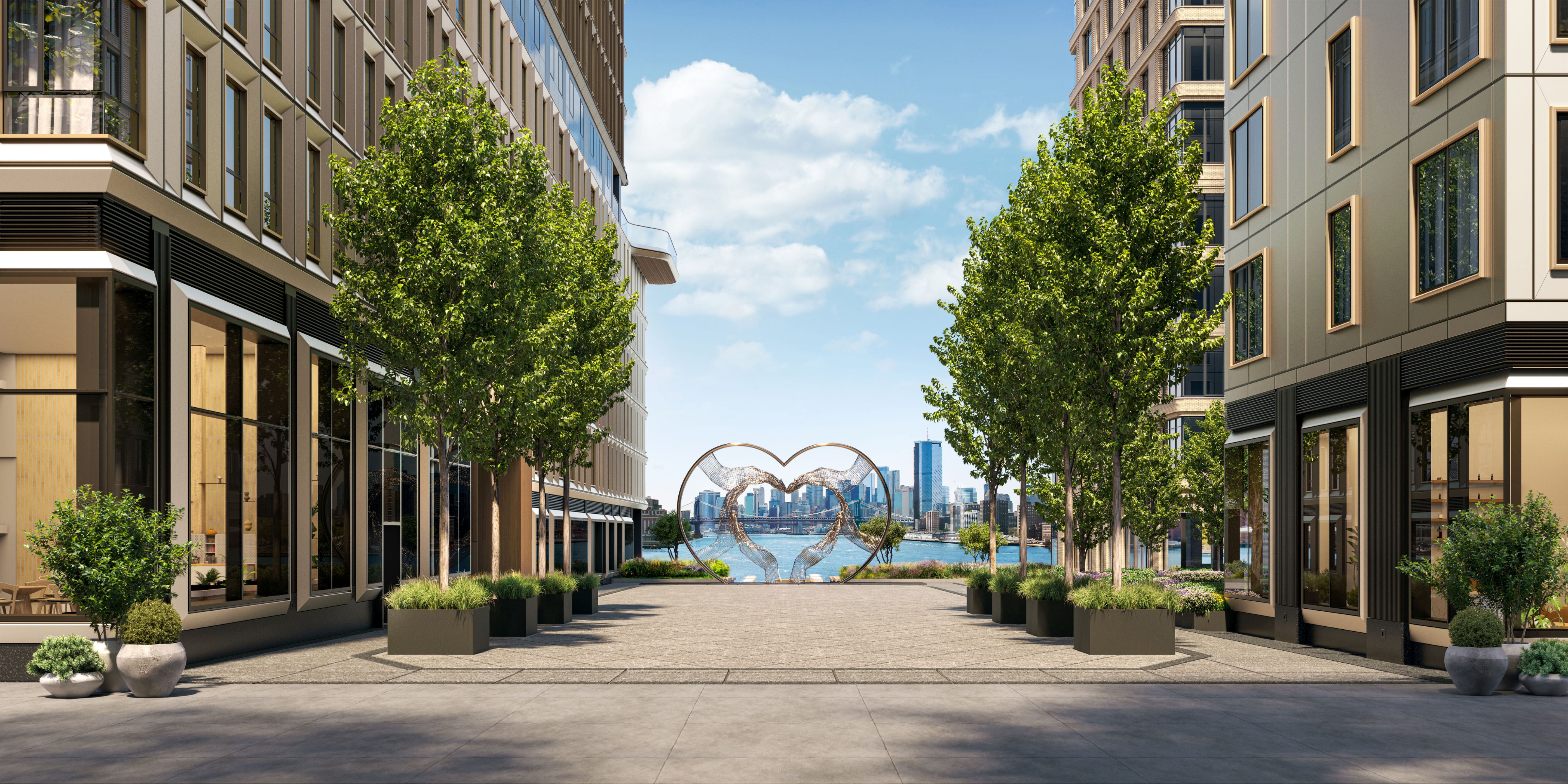 Landscaped plaza with a modern sculpture and waterfront views at One Williamsburg Wharf luxury condominiums in Brooklyn, NY.