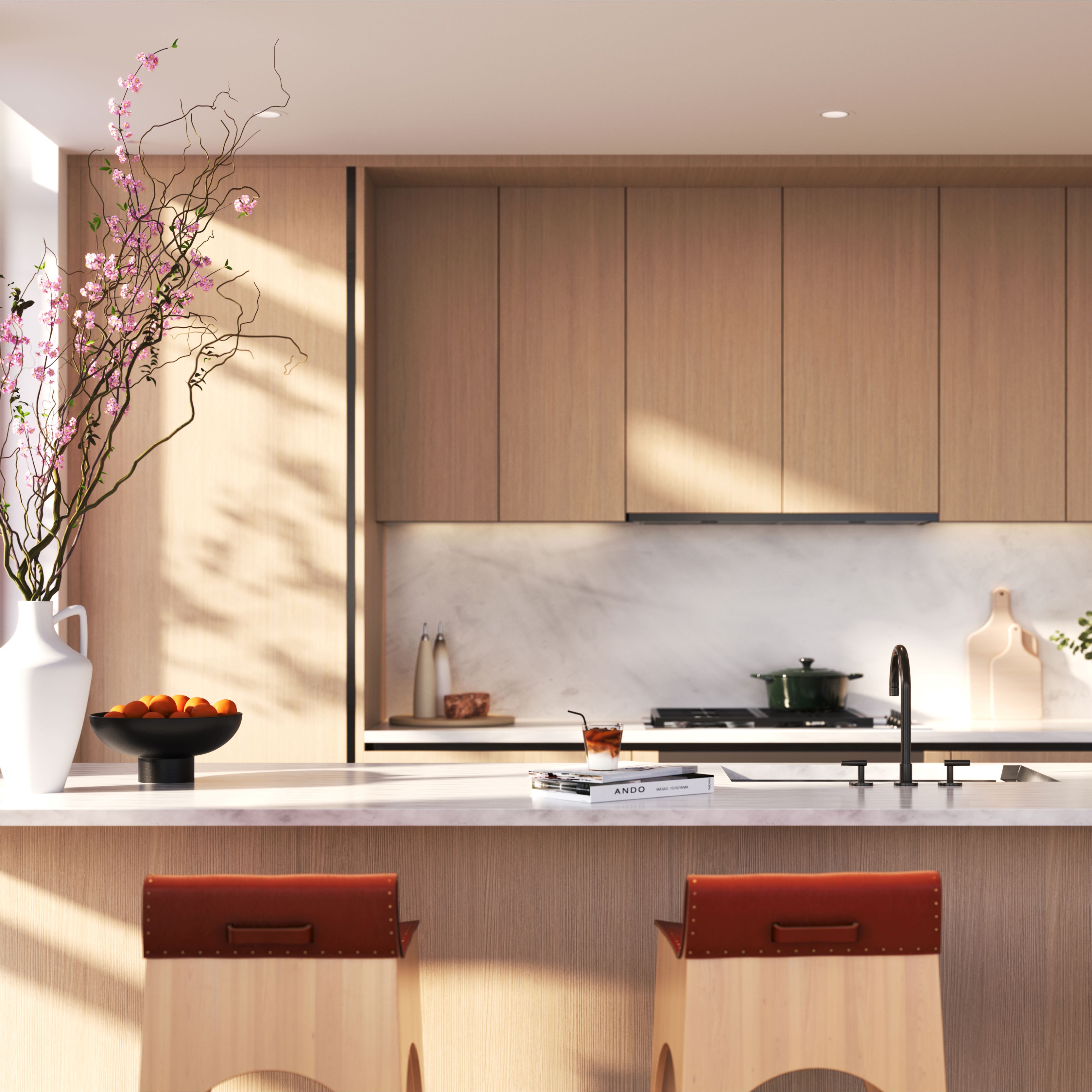 Modern kitchen at One Williamsburg Wharf, new condos in Brooklyn, featuring wood cabinetry, a marble countertop and backsplash, and an island with bar seating.