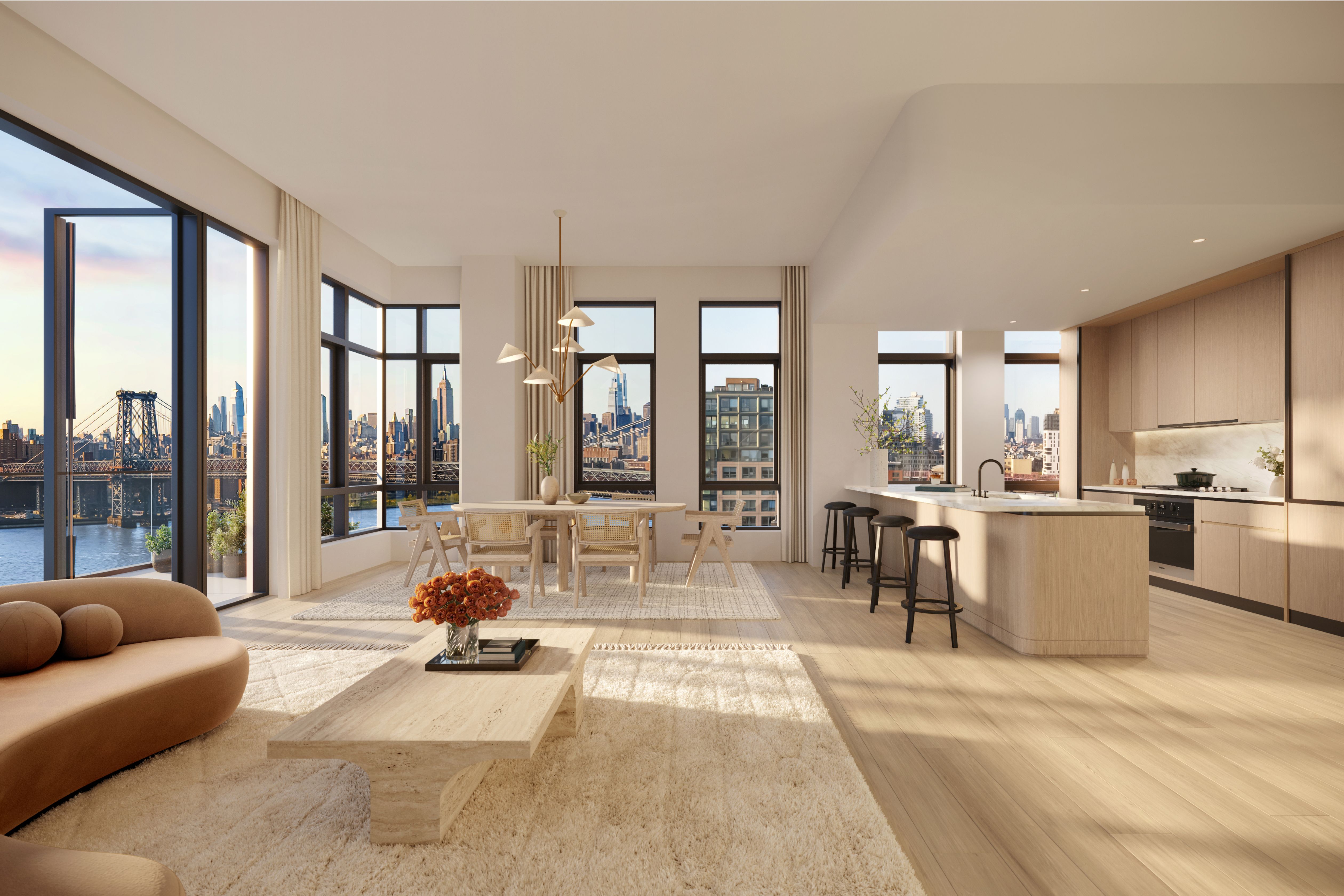 Open concept living and dining area in a luxury Williamsburg penthouse at One Williamsburg Wharf, with modern kitchen, large windows, and city views.