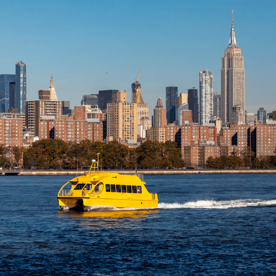 Yellow boat on the East River in Williamsburg, Brooklyn