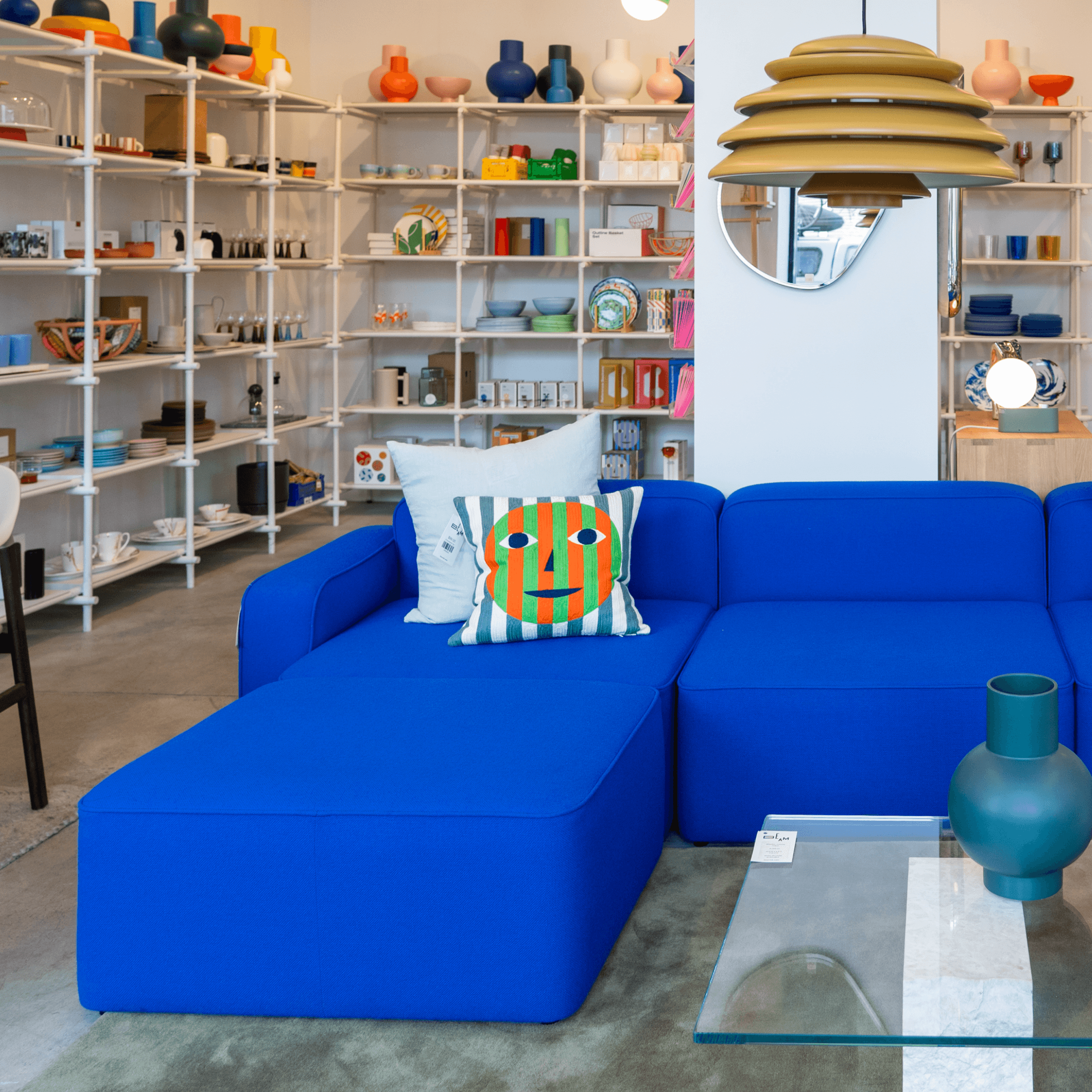 Bright blue sofa inside a home goods retail store - Design in Williamsburg, Brooklyn