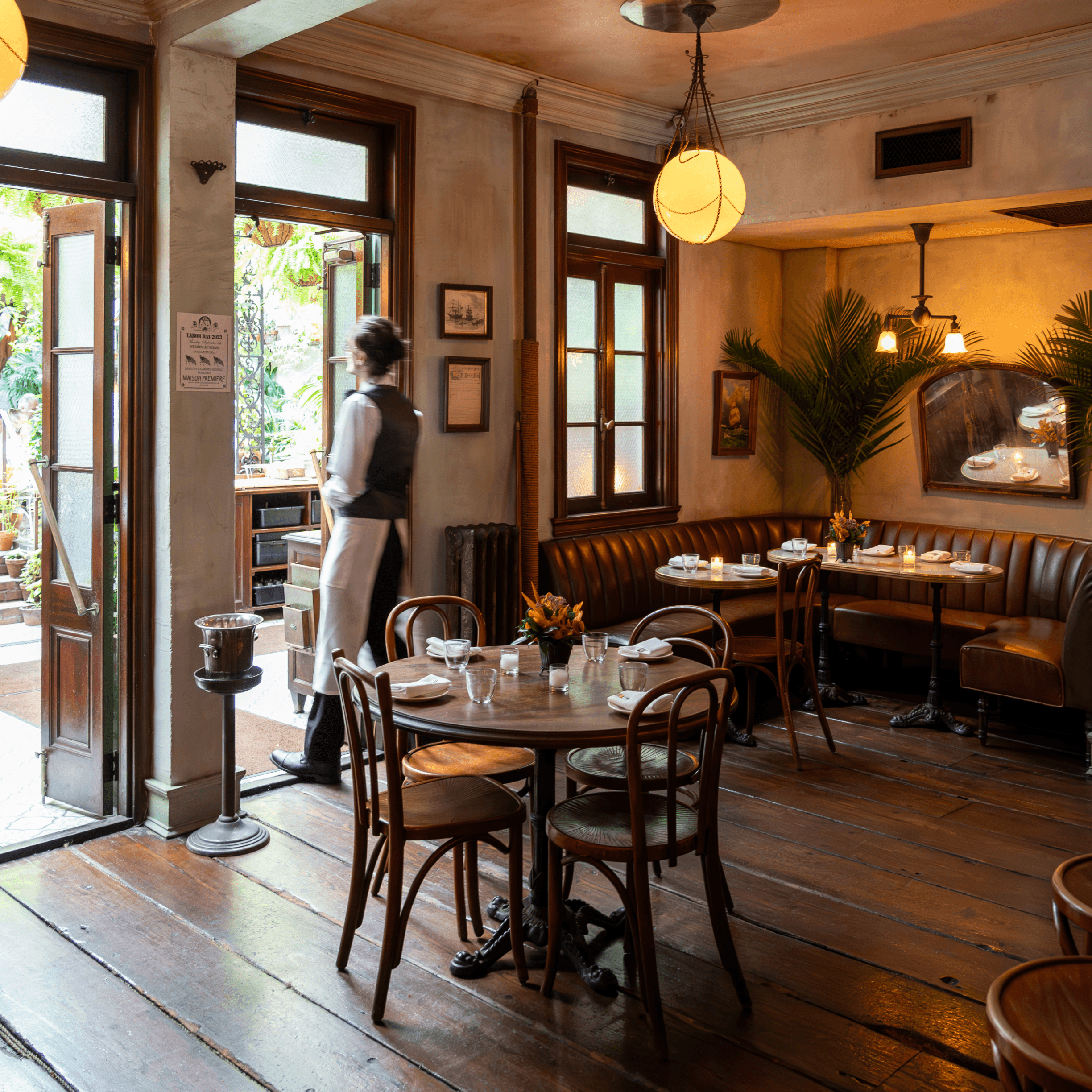 Waiter exiting a swanky restaurant in Williamsburg, Brooklyn.