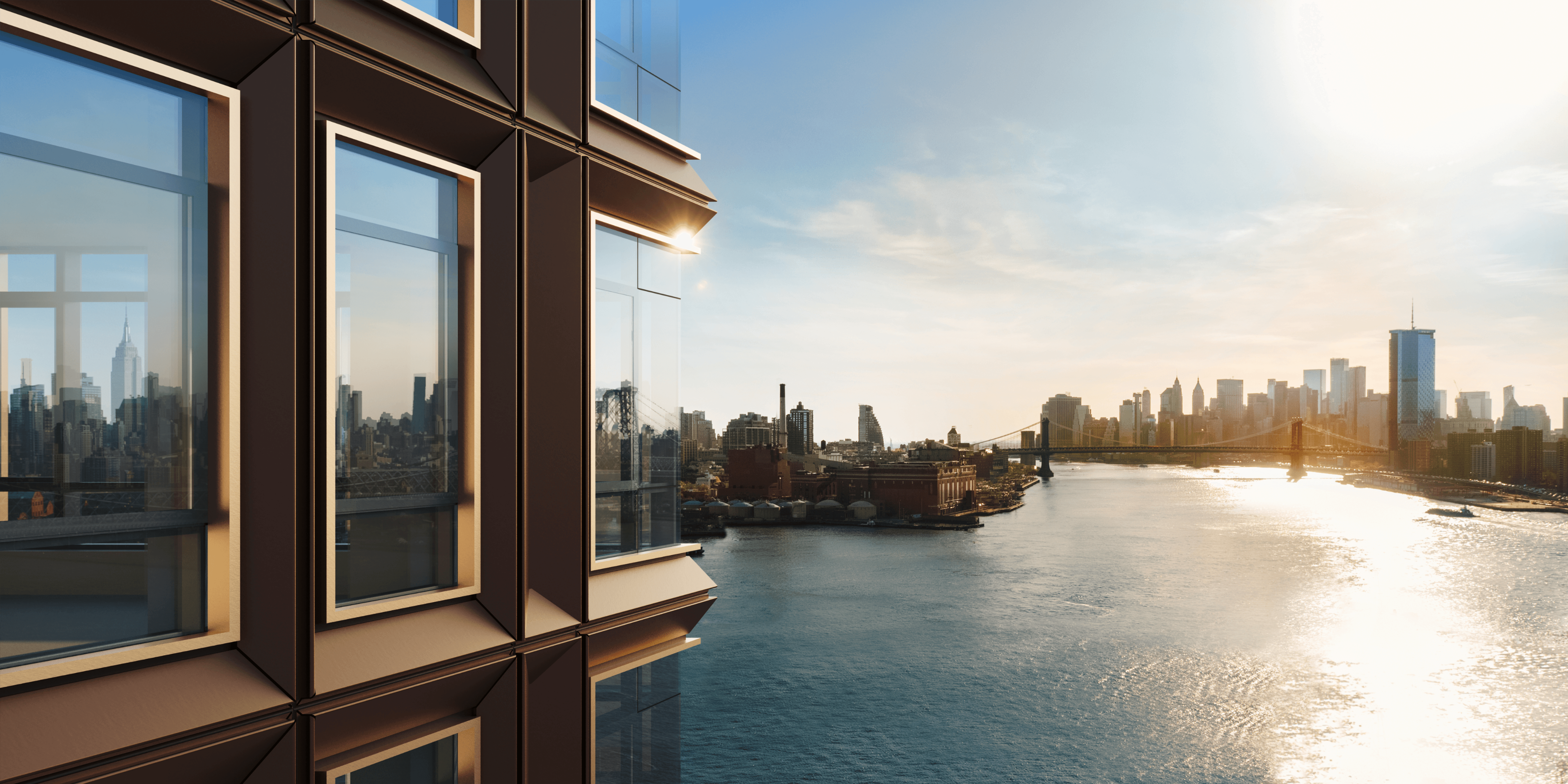 Floor-to-ceiling windows at One Williamsburg Wharf, a luxury residential building in Brooklyn with panoramic views of the East River and the Manhattan skyline.