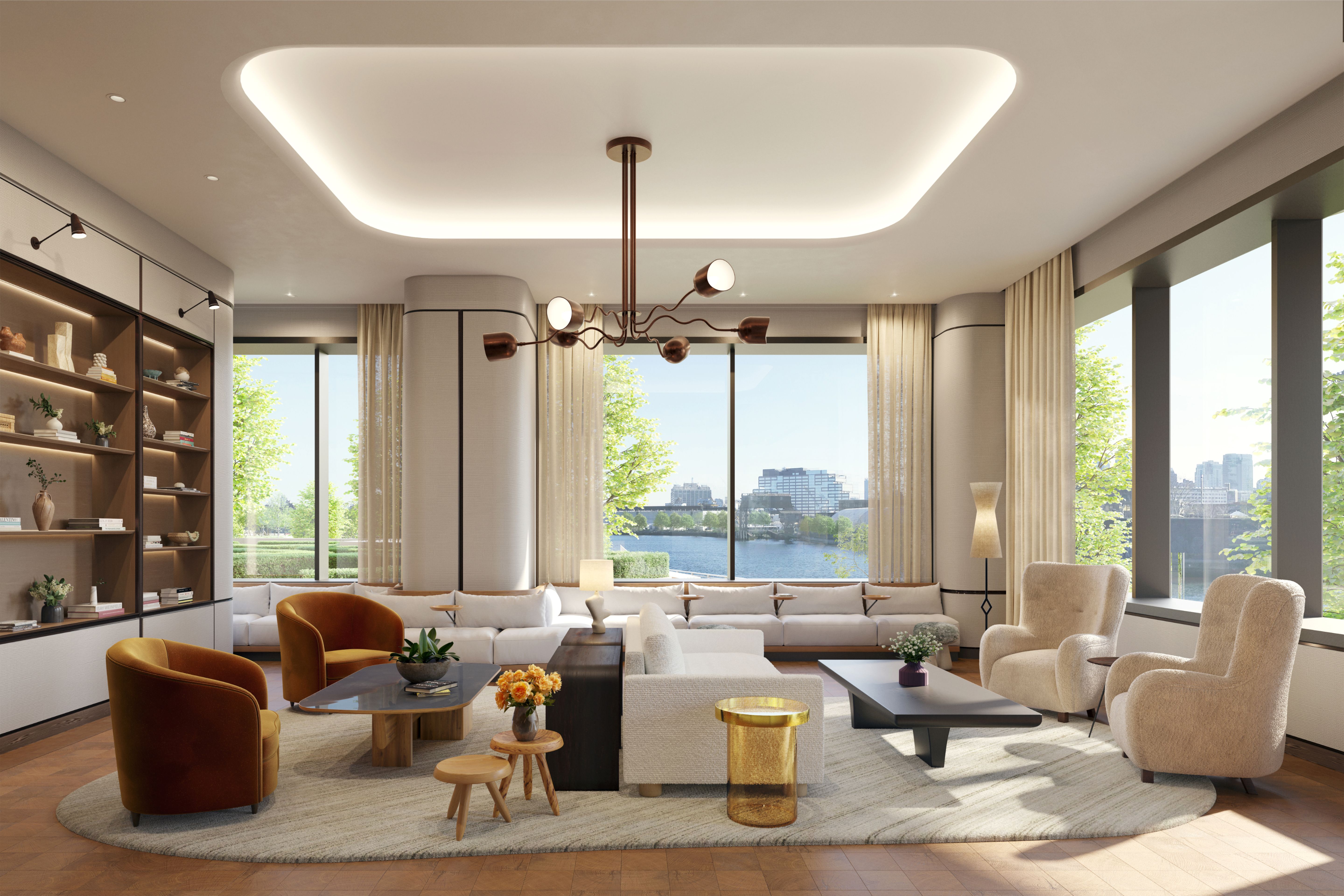 Resident lounge at One Williamsburg Wharf with comfortable seating, a library, and city views.